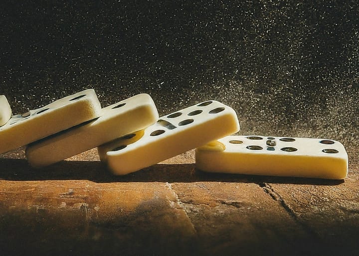 Close-up of dominoes falling