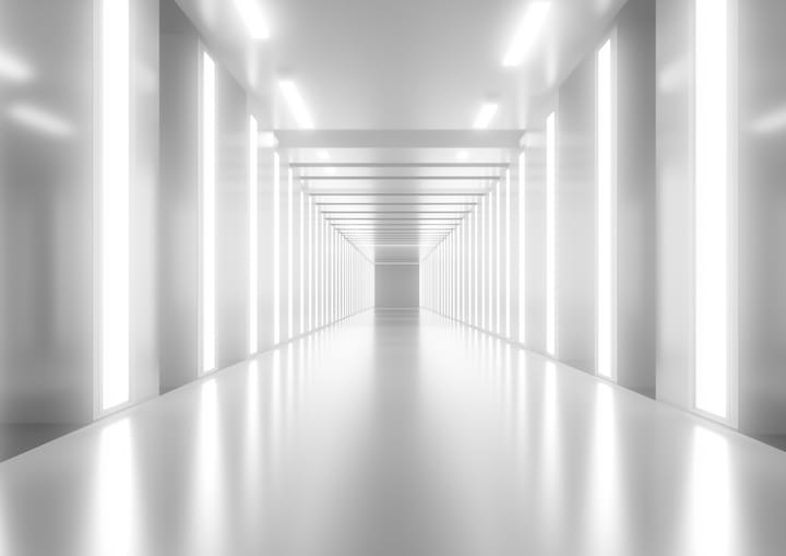 A highly lit modern corridor with lights.